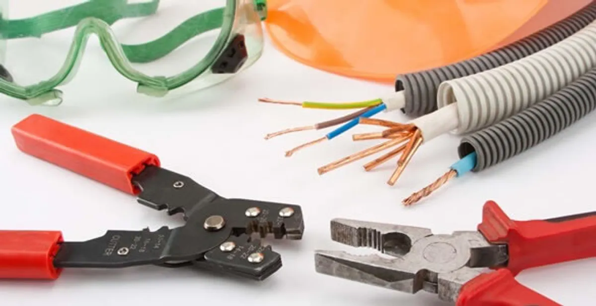 Electrical wiring repair with professional tools and safety equipment in West Des Moines, IA