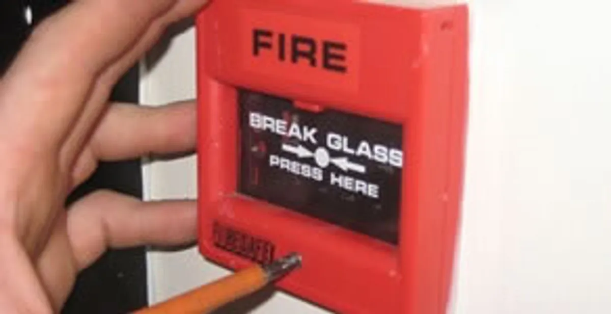 fire alarm installation service showing manual fire alarm pull station installed by licensed electricians in Des Moines, IA