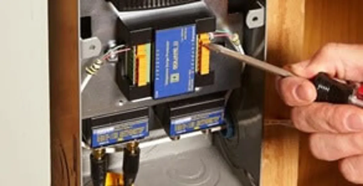 Whole home surge protection device being installed by a licensed electrician to protect electrical systems in Des Moines, IA