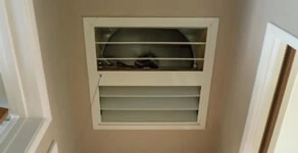 whole house fan installation services with ceiling-mounted ventilation system in Des Moines, IA